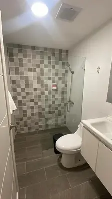 a bathroom with a toilet and a sink at Hotel Boutique Brisas Colonial in Santo Domingo