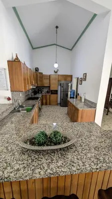 a large kitchen with a large island in the middle at Cofresi Villas in Maggiolo