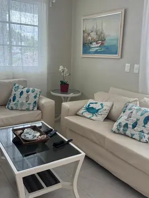 a living room with two couches and a coffee table at Lunamare Residence in Los Grini