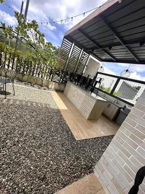 a patio of a house with a roof at Belive 01 Condo in Santiago, the heart of the city in Santiago de los Caballeros