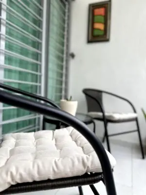 a chair with a white mattress on a porch at Belive 01 Condo in Santiago, the heart of the city in Santiago de los Caballeros