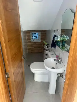 a bathroom with a toilet and a sink at Villa Tropical Paradise Pool Rooftop in San Felipe de Puerto Plata