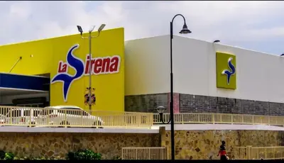 a mexican supermarket with a sign on the side of a building at Villa Tropical Paradise Pool Rooftop in San Felipe de Puerto Plata