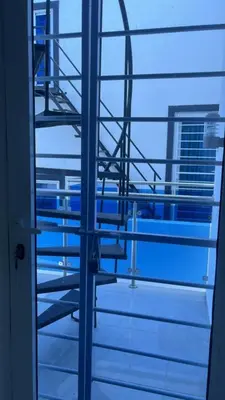 a view from the window of a room with a view of a building at Villa Tropical Paradise Pool Rooftop in San Felipe de Puerto Plata