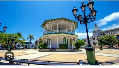 a building with a street light in front of it at Villa Tropical Paradise Pool Rooftop in San Felipe de Puerto Plata