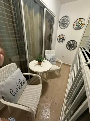 a balcony with a table and a chair and a table at Sweet dreams Tropical paradise in San Isidro