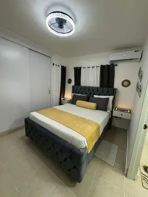 a bedroom with a large bed in a room at Sweet dreams Tropical paradise in San Isidro