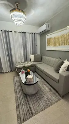 a living room with a couch and a coffee table at Sweet dreams Tropical paradise in San Isidro