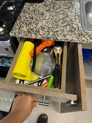 a drawer under a kitchen counter with a bunch of tools at Sweet dreams Tropical paradise in San Isidro