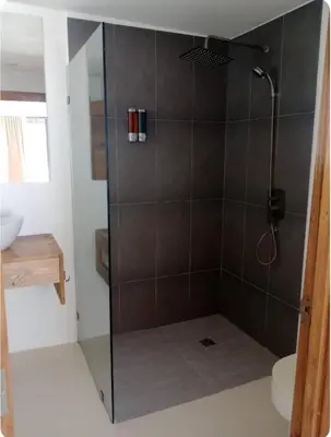 a shower with a glass door in a bathroom at Kainos Tropical Boutique Hotel in Las Terrenas