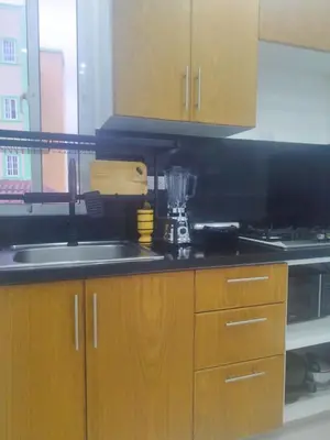 a kitchen with a sink and a counter top at Acogedor apartamento a cerca de la playa in San Felipe de Puerto Plata