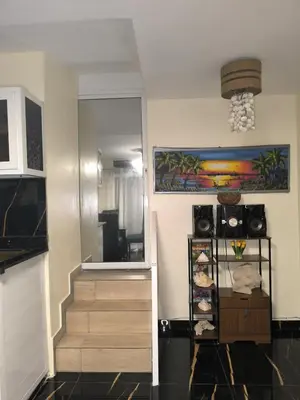 a room with a staircase and a stair case at Escape en terrazas del caribe con psicina y playa in Boca Chica