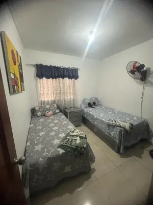 a bedroom with two beds and a window at Beautiful accommodation in Los Paredones