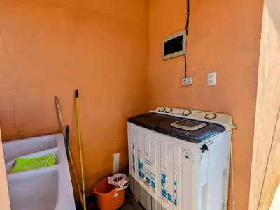 a kitchen with a stove and a tub in a room at Buenos Aires Apartments in Río San Juan