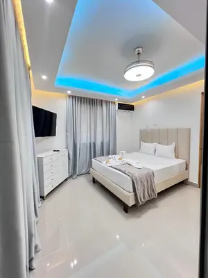 a bedroom with a bed and a blue ceiling at Sky Golden in Los Altos de Jalisco
