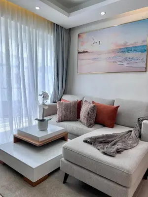 a living room with a couch and a table at Sky Golden in Los Altos de Jalisco