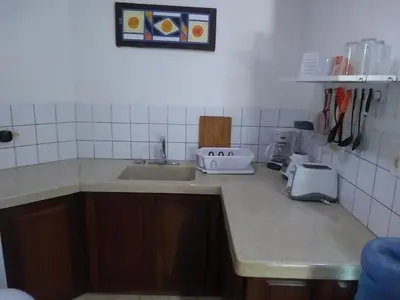 a kitchen with a sink and a counter top at Surf & Stay Waveriders, Encuentro in Cabarete