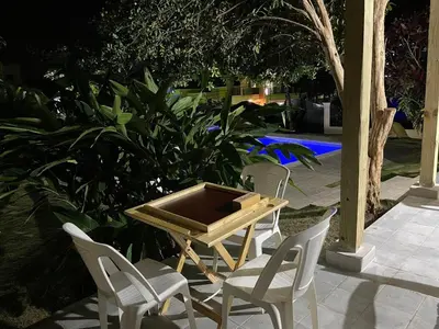 a table and chairs with a table and a table and chairs at Villa BayRum in San Felipe de Puerto Plata