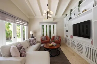 a living room with a white couch and a tv at Villa en Casa de Campo 10127 in Colorado