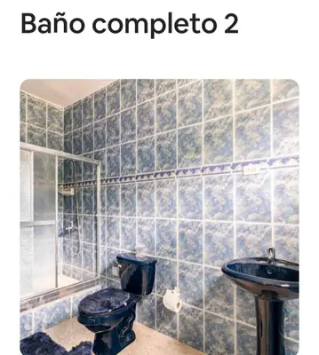 a bathroom with a toilet and a sink at paradise ranch san cristobal in San Cristóbal