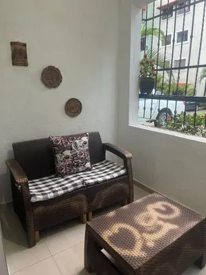 a living room with a couch and a window at Tú hogar en ciudad Juan Bosch in Los Paredones