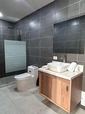 a bathroom with a sink and a toilet at Refugio Verde Las Terrenas in Las Terrenas