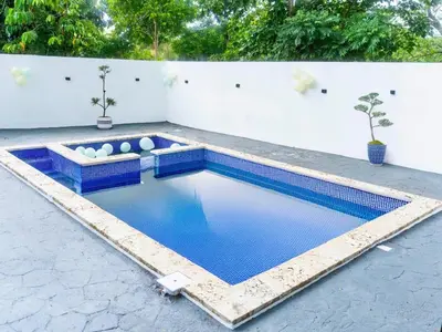 a swimming pool in the middle of a patio at Centrally located in El pino la vega, space for 8 or more guest, heated pool in El Pino