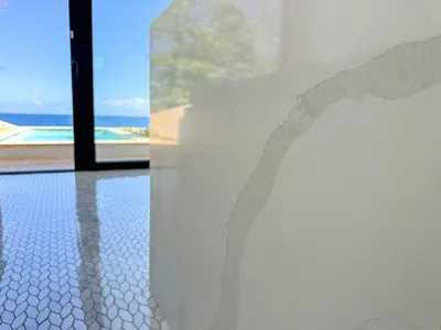 a wall in a room with a view of the ocean at Tesoro Villas in Río San Juan