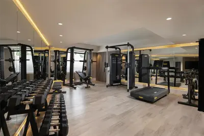 a gym with lots of treadmills and elliptical machines at Royal Beach Hotel Punta Cana, A JdV by Hyatt in Punta Cana