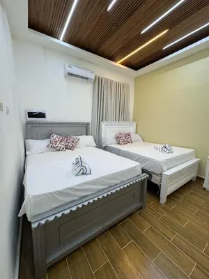 a bedroom with two beds in a room at Villas Las Indigenas in Imbert