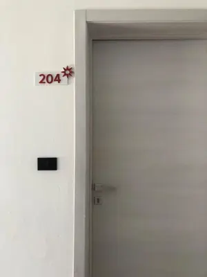 a door with a sign next to it at Cozy 2 bedroom Beach Apto in Bayahibe