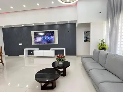 a living room with a couch and a tv at magnifica villa en cabrera in Cabrera