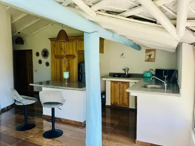a kitchen with a sink and a counter top at The Coco Garden Cabin in Las Galeras