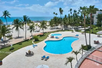 an aerial view of the pool at the resort at Escape Beachfront Condo Costa del Sol Juan Dolio in Los Corrales