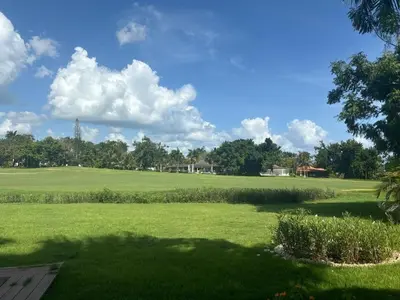 a view of a large green field of grass at Casa de Campo Golf, Villa La Romana in La Romana