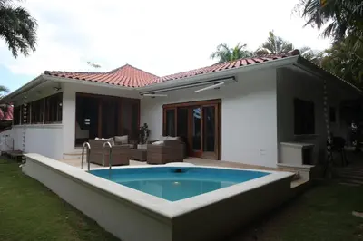a house with a swimming pool in the yard at Casa de Campo Golf, Villa La Romana in La Romana