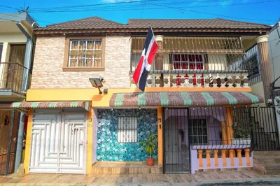 a building with a flag in front of it at HERMOS APARTAMENTo in Santiago de los Caballeros