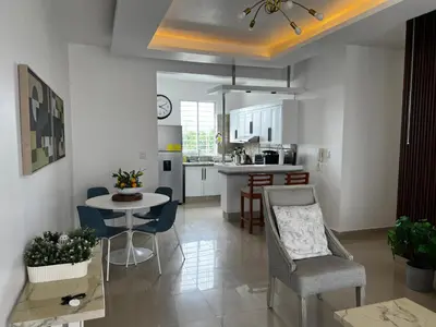 a kitchen and living room with a table and chairs at Margarita 4toB in Marilópez