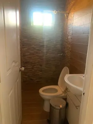 a bathroom with a toilet and a sink at Casa modesta para disfrutar in Colorado