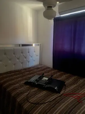 a black bag sitting on top of a bed at Casa modesta para disfrutar in Colorado