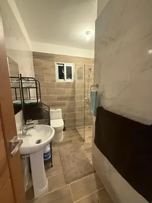 a bathroom with a sink and a toilet and a shower at Villa con piscina privada en Punta Cana in Punta Cana