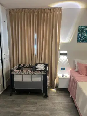 a bedroom with a desk in front of a window at Tranquil 3 Bedroom Apartment - Pool & Private Beach Access in Punta Cana