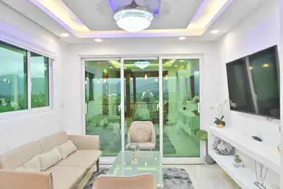 a living room with a couch and a table at Casa con jacuzzi in Santiago de los Caballeros
