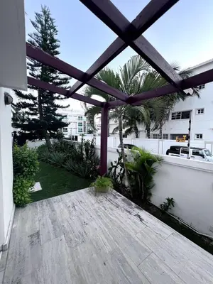 a view of a patio with a wooden pergola at Jojo's Caribbean Retreat in Punta Cana