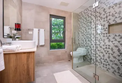 a bathroom with a sink and a shower and a toilet at Amare Residences - Beachfront complex in Las Terrenas