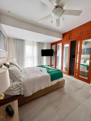 a bedroom with a bed and a ceiling fan at Comodo departamento centrico SD in Santo Domingo