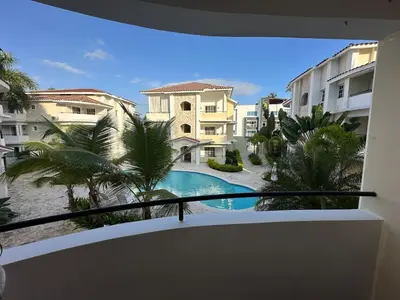 a view of a swimming pool from the balcony of a apartment at The best place to rest, Arenas del Caribe in Punta Cana
