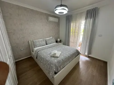 a bedroom with a bed with two towels on it at The best place to rest, Arenas del Caribe in Punta Cana