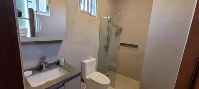 a bathroom with a shower and a toilet and a sink at Vibe Residence Gorgeous Penthouse with Jacuzzi & outstanding Sea & Natural Preserve view in La Laguna