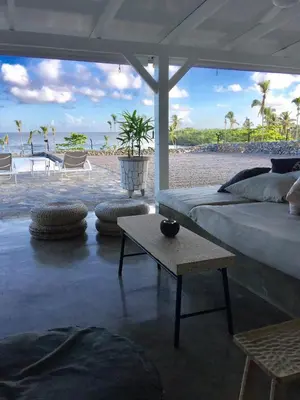 a living room with a bed and a coffee table at The Bliss of JAVO BEACH in Las Galeras